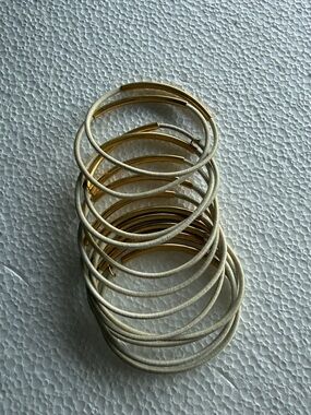 12 band stacking bracelet. Alliegro off white / gold tone tubing.